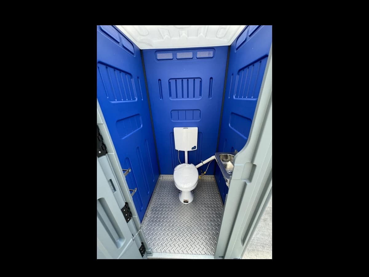 SC-100 sewer connect toilet interior with ceramic toilet