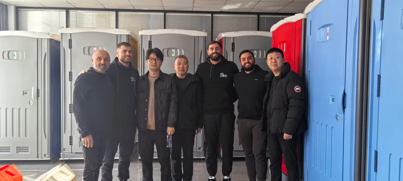 Overseas buyers reviewing Sunrise portable toilet products at the factory